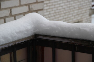 snow on the railing, large, wooden, snow, snowdrift, snowy day,