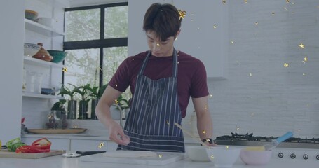 Shaping dough teen Korean wearing maroon-tee navy-striped-apron in home-kitchen, with marble slab © vectorfusionart