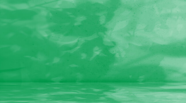 Elegant green marble stage or studio background featuring soft dappled leaf shadows. Ideal for product displays cosmetic mockups and nature-inspired digital backdrops