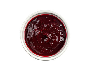 Top-down shot of a small white bowl filled with glistening, dark berry compote