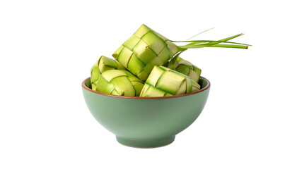 Woven rice cakes rest in a green bowl against a black background