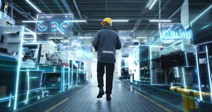 Male Factory Worker Through Modern Production Hall as AR Dashboards and Digital Twin Overlays Map Machines, Track KPI Percentages, Visualize Iot Data. Industry 4.0 Smart Manufacturing, Automation