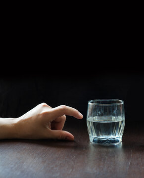 An optimist and a pessimist's opinion about a glass of water
