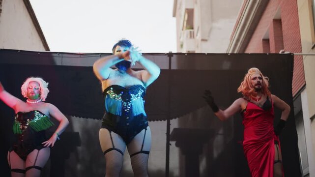 Bearded Drag Queens Perform Stunning Routines at Outdoor Festival in Vibrant Cabaret Costumes