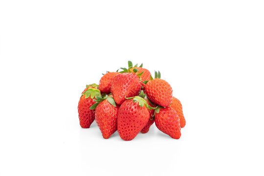 Fresh organic akihime strawberries on white background.