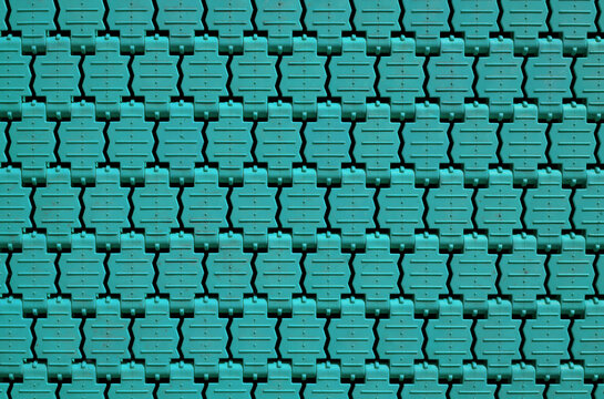 Close-up of the aquamarine colored texture of the ground trampoline for children