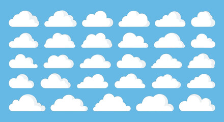 Obraz premium A collection of various white cartoon clouds against a clear blue sky background, illustrating different shapes and sizes.