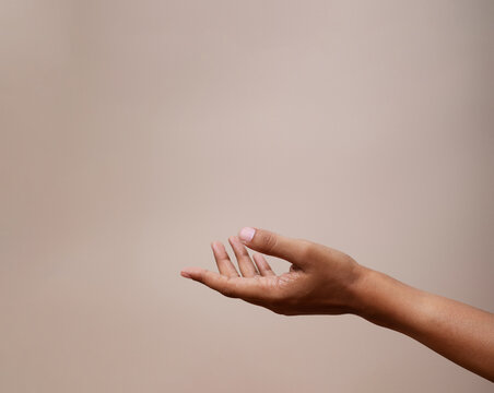 Sensitive hand gesture photographed against a soft background, conveying emotion and delicacy