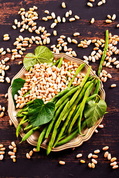 Common bean on darkj table with leaf