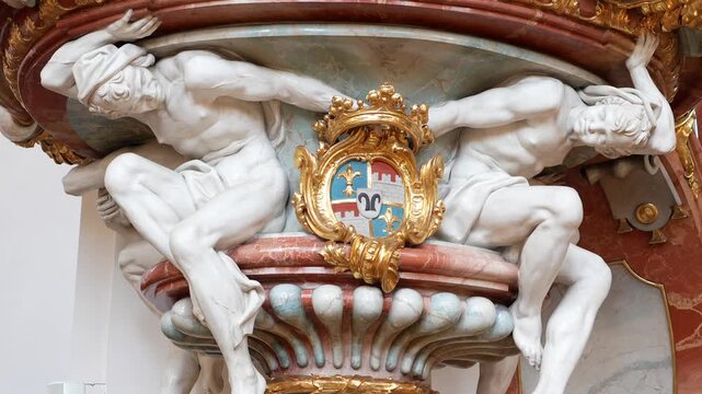 Detail of the putti (cherub) sculptures and decorative stucco art on the walls of the basilica.