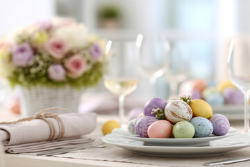 Bright Easter table setting includes white plates with colorful eggs and a simple floral centerpiece. The table is ready for a festive meal with family and friends during Easter