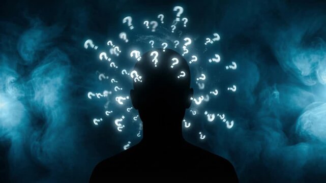 Silhouette of a human head with glowing question marks floating in blue smoke. Person thinking about a complex problem or mystery to find a solution. Confusion and psychology concept