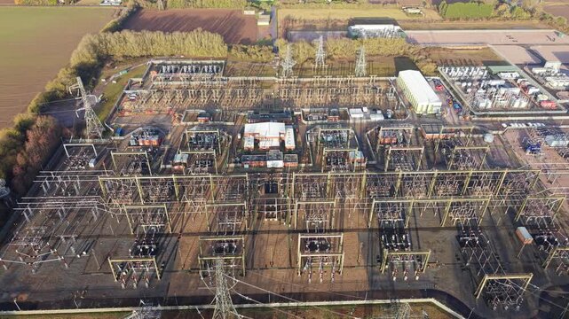 Aerial view of the National Grid Walpole Substation reveals an intricate network of power lines and equipment, Wisbech, United Kingdom.