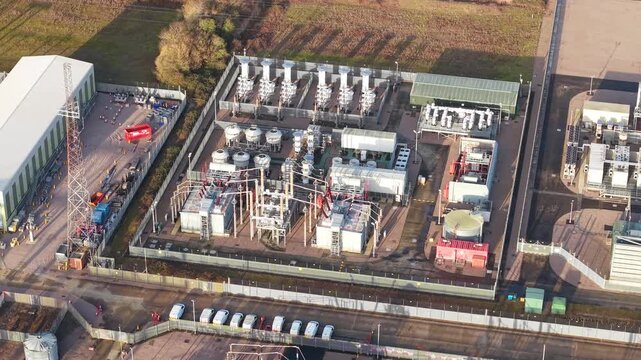 Aerial view of the National Grid Walpole Substation, showing complex industrial infrastructure with metallic structures and buildings, Wisbech, United Kingdom.