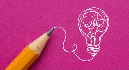 Pencil drawing a light bulb on purple background