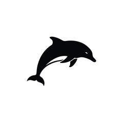 Obraz premium A sleek black silhouette of a dolphin leaping playfully from water