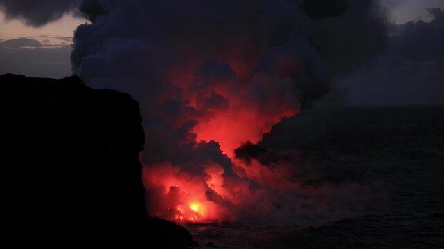 Dramatic volcanic lava flow entering the ocean on the Big Island of Hawaii. Glowing molten lava meets seawater, creating intense steam clouds and fiery red light against a dark coastal landscape.