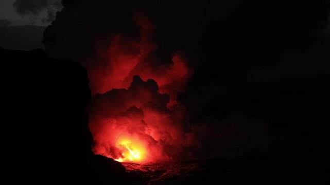 Dramatic volcanic lava flow entering the ocean on the Big Island of Hawaii. Glowing molten lava meets seawater, creating intense steam clouds and fiery red light against a dark coastal landscape.