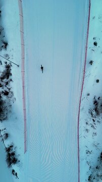 Aerial view skier racing at ski resort with snow