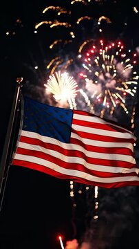A Dazzling Display of Fireworks Illuminates the Night Sky Behind the Waving American Flag, Celebrating Unity and Freedom in a Spectacular Visual Performance