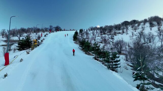 Aerial view skier racing at ski resort with snow