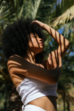 Portrait of young woman with shadow on her body