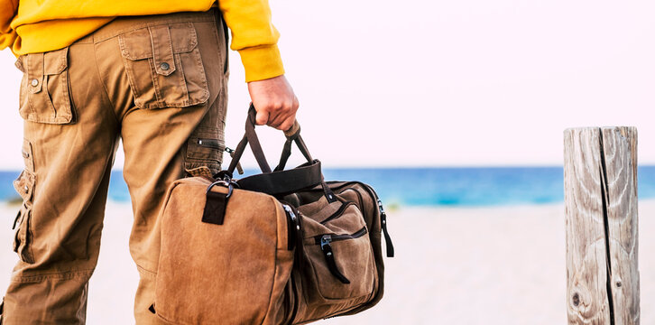 Man with brown basket at the beach