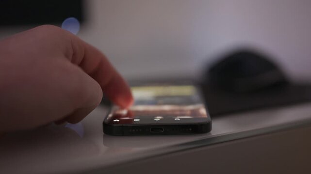 Close up video of a person doom scrolling on social media on a smartphone with content intentionally out of focus, conveying digital addiction technology fatigue and modern screen time behavior for me