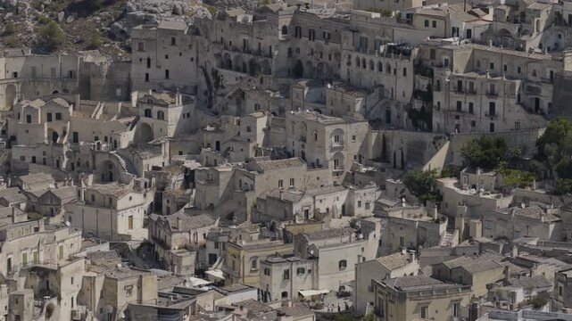 Aerial view of the ancient Sassi di Matera, a mesmerizing landscape of stone-carved buildings cascading down the hillside, Matera, Basilicata, Italy.