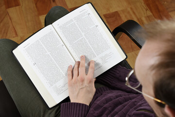 a man reads the bible 