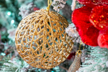 Festive holiday background with seasonal ornaments, lights, and sparkle. Celebration and winter holiday concept. Copy space.