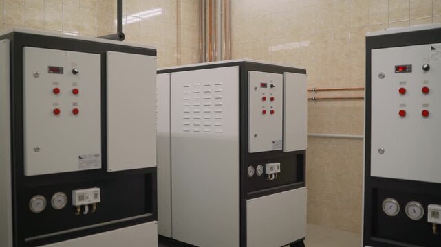 Industrial chiller units in a modern boiler room