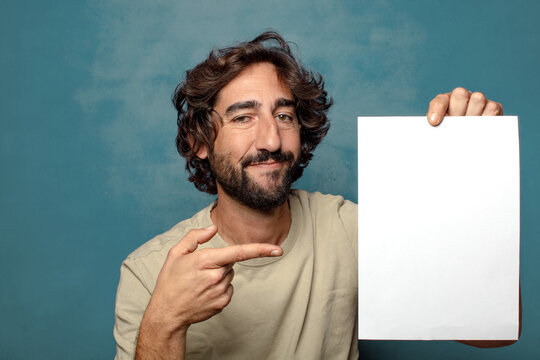 young adult bearded man with a sheet of paper