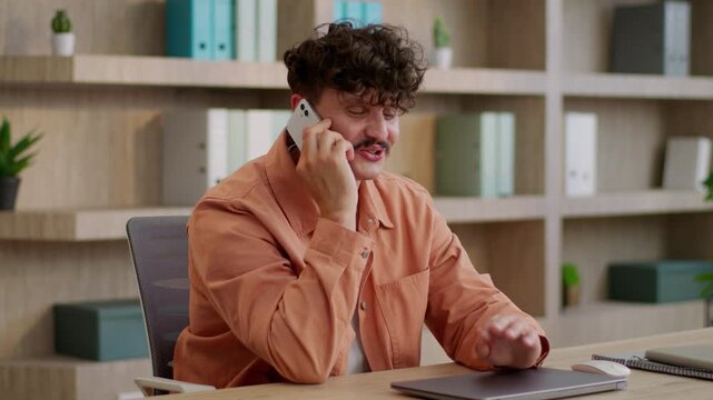 Happy Caucasian business man talking mobile phone in company at table corporate workplace businessman talk call smartphone communicating enjoy conversation specialist smiling guy male smile in office