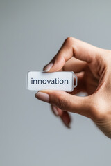Innovation technology idea concept progress future creativity startup business strategy blend into minimalist close up of hand holding small white device, clean background, modern mood