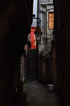 Tiny Alleyway between Historic Buildings in the City Center of Honfleur, Normandy, France