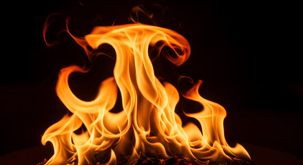 Vibrant flames dancing intensely in a dark environment, showcasing warmth, energy, and dynamic movement.