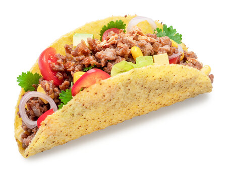 Mexican meat taco or beef stuffed tortilla isolated on white background. File contains clipping path.