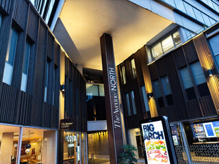 Naklejka premium Urban shopping center The Avenue North Springfield exterior in Manchester UK with modern architecture and bold signage