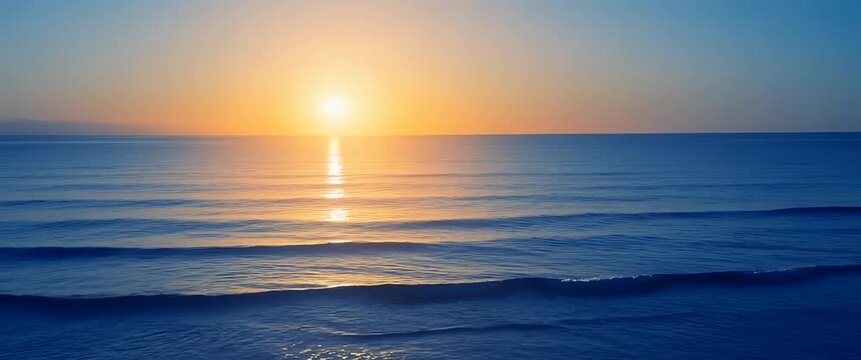 A warm sun sets on a tranquil horizon, casting a soft glow as gentle waves ripple and a slow pan captures the cinematic beauty of dusk in this serene beachscape video.