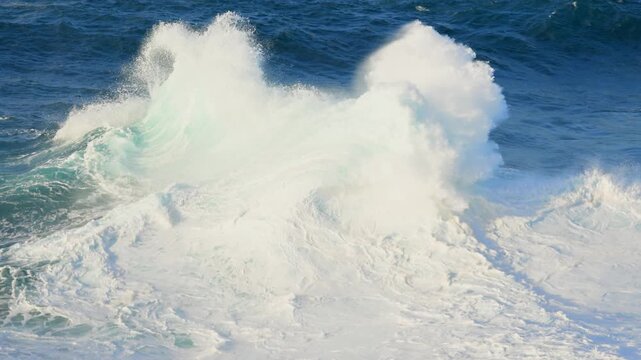 Cinematic aerial of massive Atlantic waves crashing on Gran Canaria coast with dangerous swell and red flag sea conditions