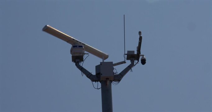 Wide shot of the radar on the coastal monitoring system mast at the Trafalgar Point, stone jetty in Morecambe
