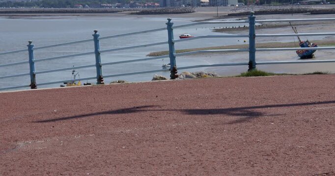 Shot of the Shadow of the radar on the coastal monitoring system mast at the Trafalgar Point, stone jetty in Morecambe