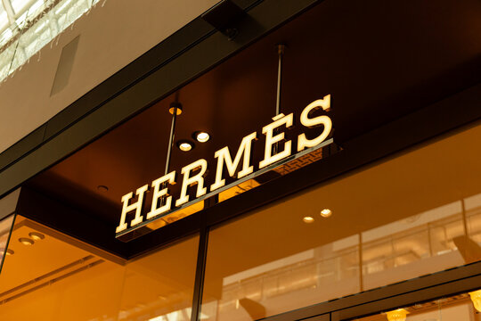 Singapore - January 27, 2026: Hermes store features unique signs and window displays in Singapore. Shoppers pass by, enjoying the vibrant atmosphere of the retail area during a busy afternoon