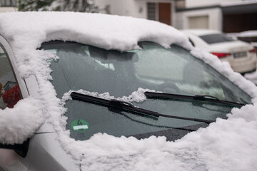 car completely covered with thick white snow after heavy snowfall, Extreme winter weather challenges, automotive seasonal care concept, frozen vehicle in suburban neighborhood, overnight blizzard