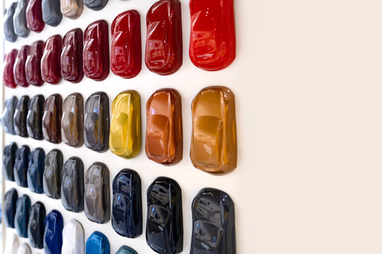Car paint color samples with matte and glossy textures for multiple models, showroom palette, glossy finishes, premium interior display, Mini car models, automotive selection inspiration