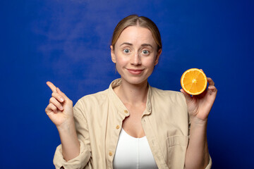 young adult blonde woman with an orange