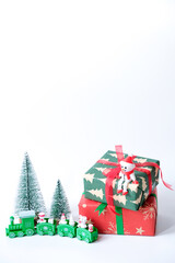 Christmas and holiday ornament decorations with gift, snowman, train and pine tree isolated on white background
