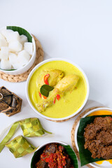 The dishes served during Eid celebrations are rendang, dendeng balado, opor ayam, and ketupat. Isolated on white background