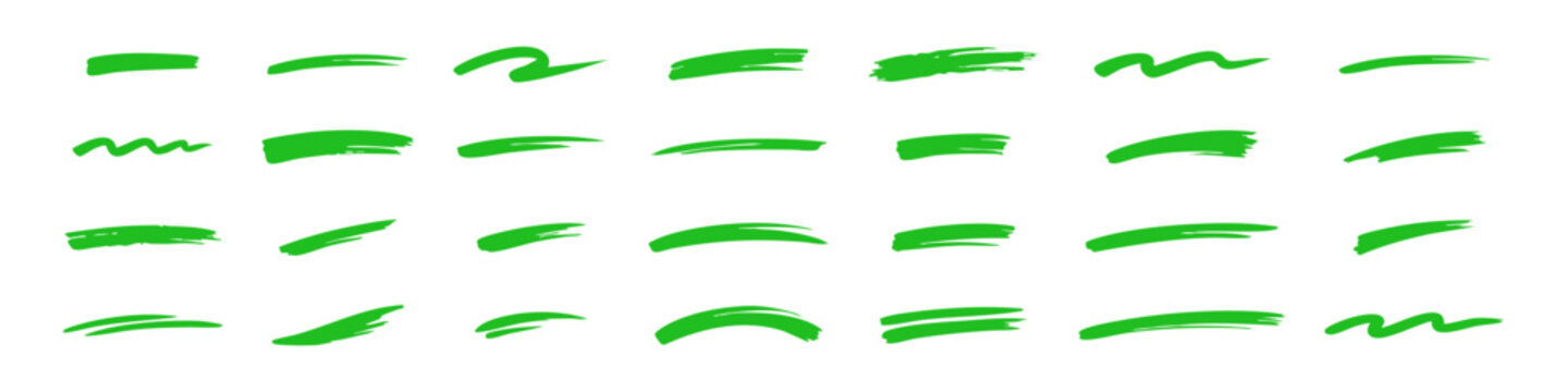 Set of colorful hand-drawn brush strokes, underlines, and paint swatches in black, red, green, and blue on a white background. Vector illustration.